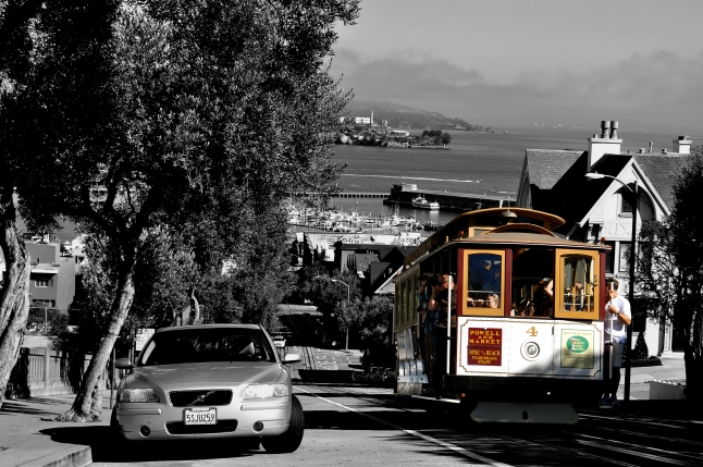 Powell and Market Cable Car in San Francisco. Look closely at the background for a glimpse of Alcatraz